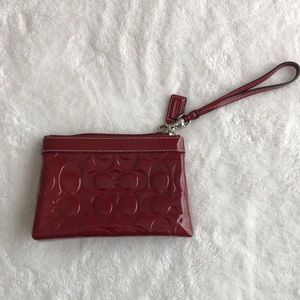Patent red Coach wristlet